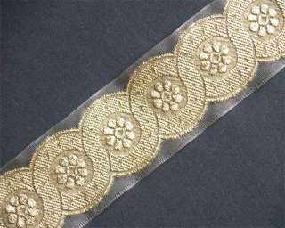 jacquard woven metallic motif adorns this organza ribbon