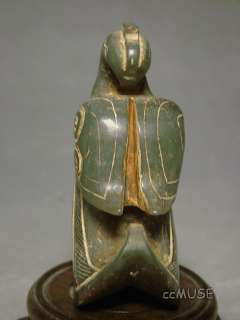   an exquisite chinese celadonish jade statue brightly and vividly