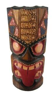 this awesome looking tiki wall mask with tongue sticking out is hand