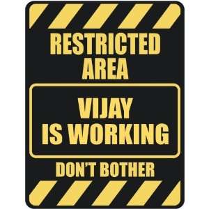   RESTRICTED AREA VIJAY IS WORKING  PARKING SIGN
