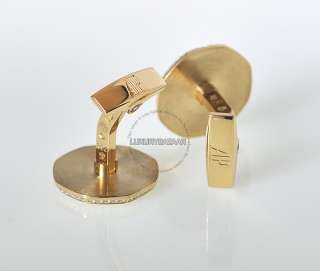 These handsome yellow gold cufflinks feature an understated edge in 